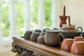 Set of Chinese Japanese Tea Cups Pot Bowls Utensils on Bamboo Wooden Tray on Cottage Terrace. Preparing Ceremony. Cozy Atmosphere