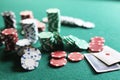 Set of chips and cards on a green baize gambling casino Royalty Free Stock Photo