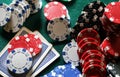 Set of chips and cards on a green baize gambling casino Royalty Free Stock Photo
