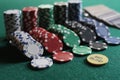Set of chips and cards on a green baize gambling casino Royalty Free Stock Photo