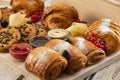 Set of chocolate croissants and cookies with syrups  decorated with berries Royalty Free Stock Photo