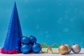 Set of christmas decoration. Balls festive cap golden glasses and red tinsel. Copy space. Xmas concept. Blue backdrop Royalty Free Stock Photo