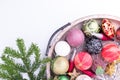 Set of Christmas decorations in wooden tray on white background. Holiday concept. Flat lay, top view Royalty Free Stock Photo