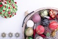 Set of Christmas decorations in wooden tray on white background. Holiday concept. Flat lay, top view Royalty Free Stock Photo