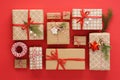 Set of Christmas gift boxes and decoration on red background Royalty Free Stock Photo