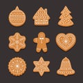 Set Christmas gingerbread: gingerbread house, snowflake, heart, xmas tree and bell on dark background.