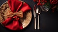 set of Christmas laid table, red napkin and luxurious plates, silver cutlery, Christmas dinner or New Year\'s Eve party Royalty Free Stock Photo