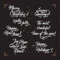 Set of Christmas and New Year related holiday brush lettering. Royalty Free Stock Photo