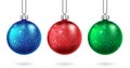Set of Christmas red, blue and green ball isolated. Sparkling glitter bauble. Christmas and New Year bauble for cards Royalty Free Stock Photo