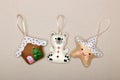 Set of Christmas tree decorations, house, polar bear, star, handmade felt on a beige background