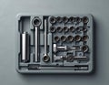 Set of chrome socket wrenches, screwdriver in gray plastic toolbox. Includes various sizes of sockets, ratchet handle, extension Royalty Free Stock Photo