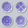 Set of circular plates with lace ornament