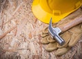 Set of claw hammer hard hat leather gloves construction concept Royalty Free Stock Photo