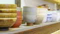 Set of clay cups in tea store. Shop of traditional tea crockery