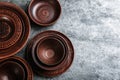 Set of clay utensils on grey table, flat lay. Space for text Royalty Free Stock Photo