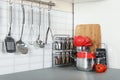 Set of clean cookware and utensils on table in kitchen Royalty Free Stock Photo