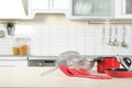 Set of clean cookware and utensils on table in kitchen. Royalty Free Stock Photo