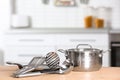 Set of clean cookware and utensils on table in kitchen Royalty Free Stock Photo