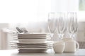 Set of clean dishware, cutlery and champagne glasses on table indoors Royalty Free Stock Photo