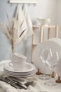 Set of clean dishware, cutlery and wineglasses on white table indoors Royalty Free Stock Photo