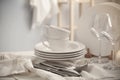 Set of clean dishware, cutlery and wineglasses on white table indoors Royalty Free Stock Photo