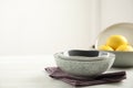 Set of clean dishware and lemons on white wooden table. Space for text Royalty Free Stock Photo