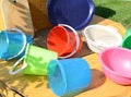 Set of clean multi-colored plastic buckets, outdoor, on a Sunny summer day in the garden Royalty Free Stock Photo