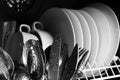 Set of clean wet tableware in dishwasher, closeup Royalty Free Stock Photo