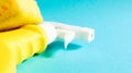 Set of cleaning products on a blue background. Yellow rag and sponge, cleaning spray, detergent. House cleaning concept