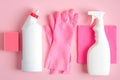 Set of cleaning supplies on pink background. House cleaning service and housekeeping concept. Flat lay, top view Royalty Free Stock Photo