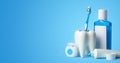 Set for cleaning teeth and mouth. Toothpaste, toothbrush, dental floss and mouthwash on a blue background Royalty Free Stock Photo