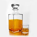 A set of clear bottles and elegant glasses for holding alcoholic beverages such as brandy and whiskey. Clear half glass liqueur