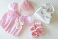 Set of clothes for a little girl, sandals, bag, cap, flat lay top view Royalty Free Stock Photo