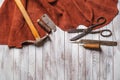 Set of cobbler tools on the light wooden background. Space for t