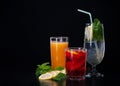 A set of cocktails of fresh fruit juices on a black background Royalty Free Stock Photo