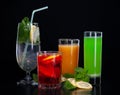 A set of cocktails of fresh fruit juices on a black background Royalty Free Stock Photo