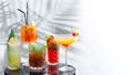 Set cocktails on marble table and light background banner. five kinds of colorful summer cocktails in glasses and shadow of tropic