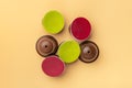 Set of coffee capsules isolated on beige background