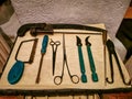 Set of colonial vintage medical instruments on a white cloth. The concept of the past medicine.