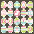 Set of color easter eggs over brown wooden background. Holiday Easter Eggs decorated with flowers, rabbit, leafs. Easter holidays