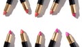 Set of color lipsticks on white background. Flat lay. Royalty Free Stock Photo
