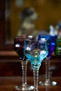 Set of colored antique wine glasses with engraving. glass vintage wine glasses Royalty Free Stock Photo