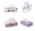 Set of colored boxes with paper napkins on white Royalty Free Stock Photo
