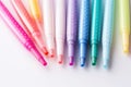 A set of colored markers on a white background