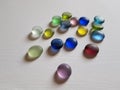 Set of colored matte translucent stones on a white table Royalty Free Stock Photo