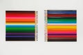 Set of colored pencils arranged in a two rows vertically opposite each other on a white background Royalty Free Stock Photo