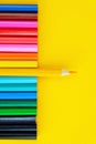 Set of colored pencils on a bright yellow background Royalty Free Stock Photo