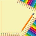 A set of colored pencils rainbow colors on a yellow background in the form of a frame for records Royalty Free Stock Photo