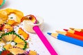 Set of colored pencils, sharpener and shavings Royalty Free Stock Photo