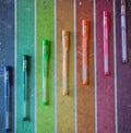 Set of coloured pens on the rainbow colourful paper